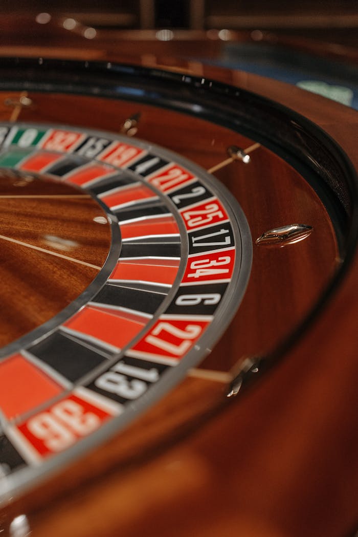 home-hero Detailed close-up of a roulette wheel in a casino, focusing on numbers and colors.