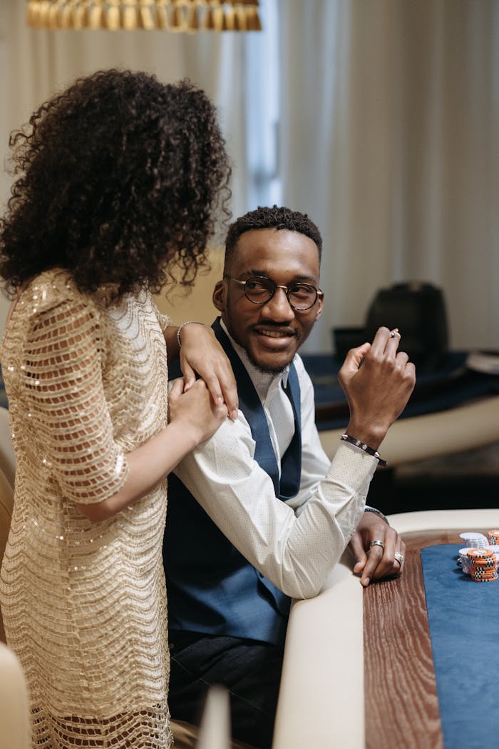 about-02 Sophisticated couple engaging in a fun casino evening indoors.